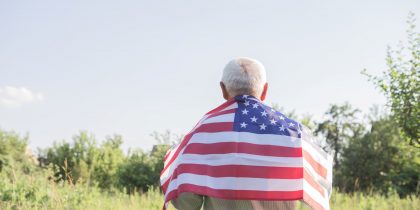 senior veteran with flag