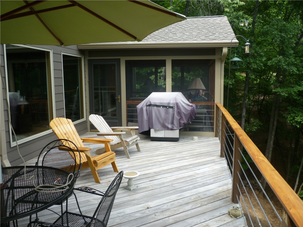 Robert Fowler's back deck, framed by woodland views.