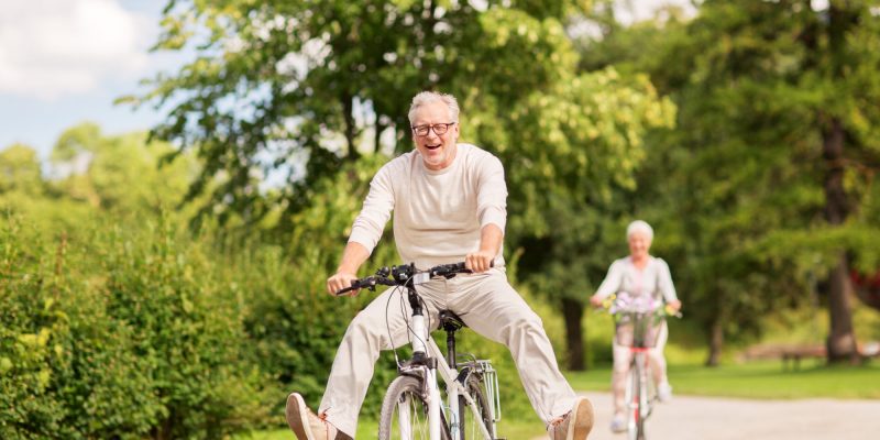 older gentleman and wife enjoying a bike ride