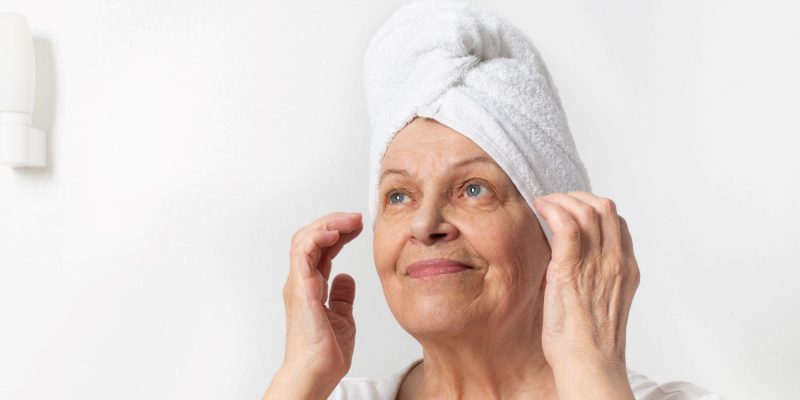 senior woman with towel on hair
