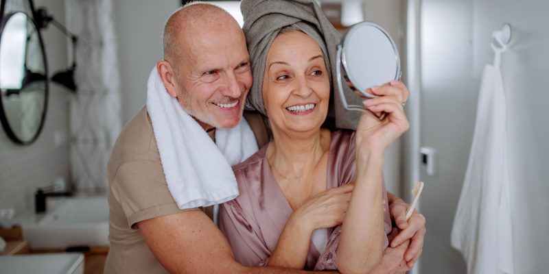 retired couple taking selfie in the bathroom