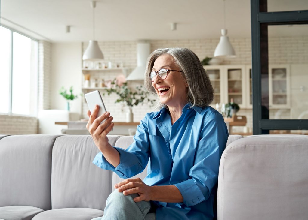 older adult woman using phone