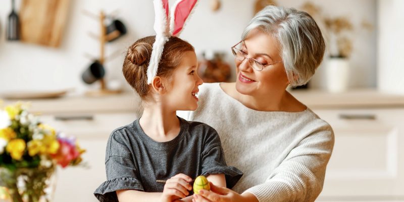 grandmother and granddaughter doing easter activities