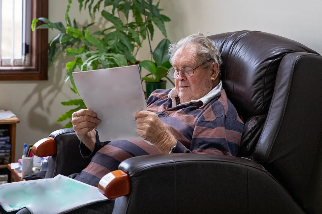 senior man reading in a recliner