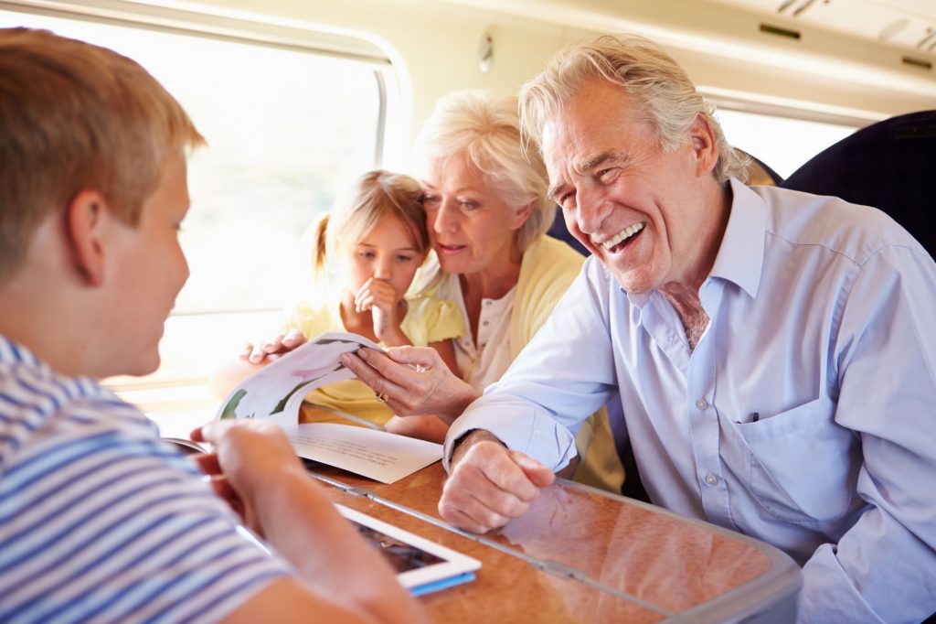 grandparents and grandchildren traveling together on a bus