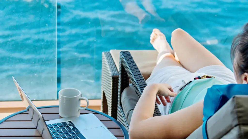 woman napping on the deck of a cruise ship