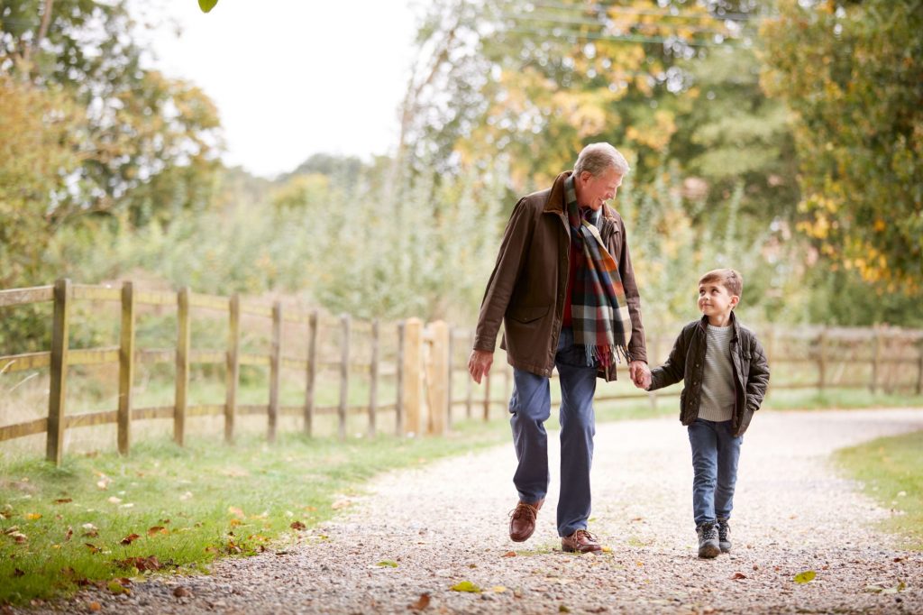 grandfather and grandson walking