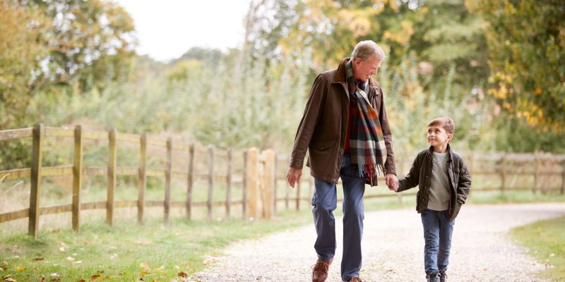 grandfather and grandson walking
