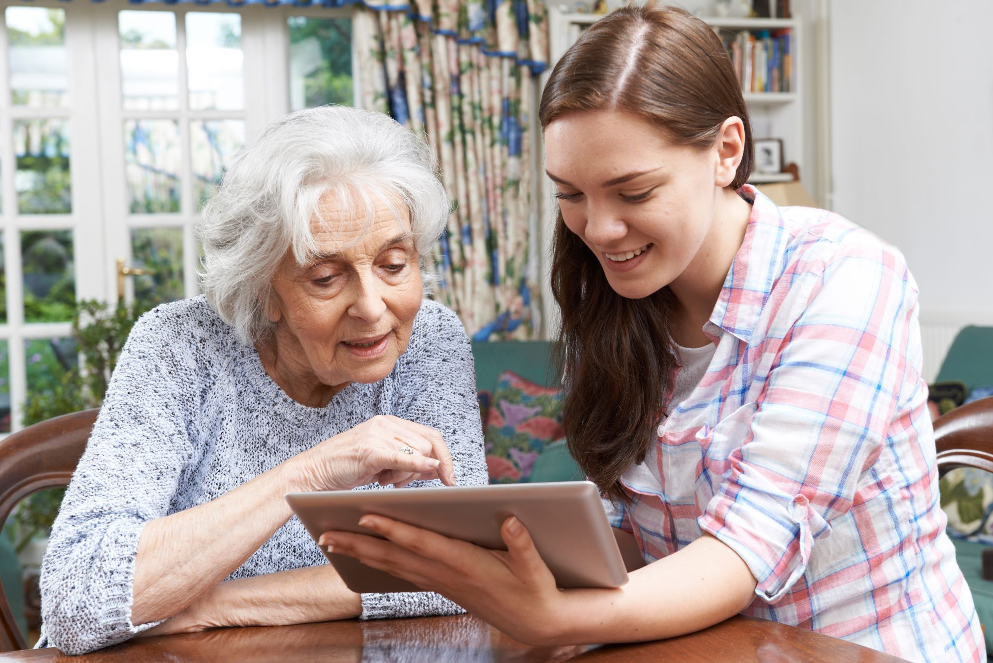 teen helping grandma