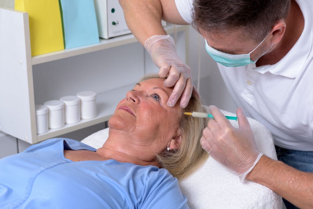 senior woman getting cosmetic procedure