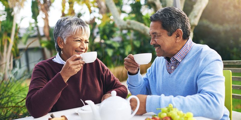 older couple having tea outdoors