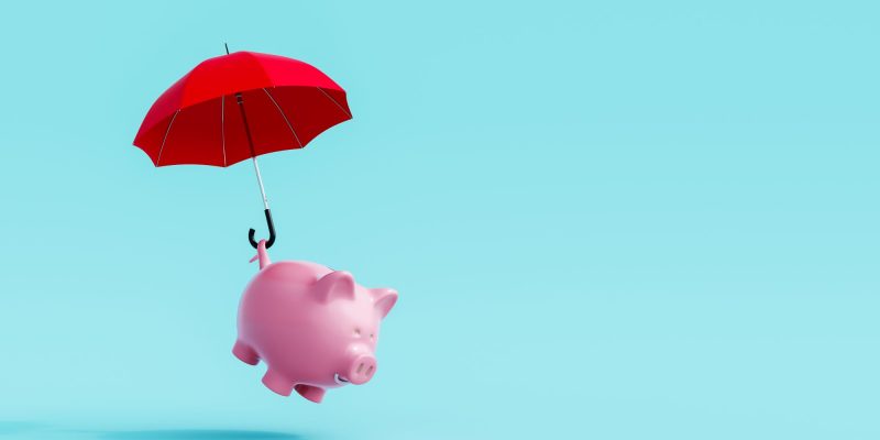 piggy bank landing with an umbrella