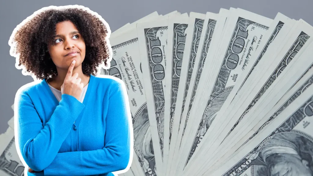 black woman with curly hair thinking about how much cash she has