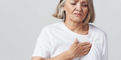 senior woman with heartburn