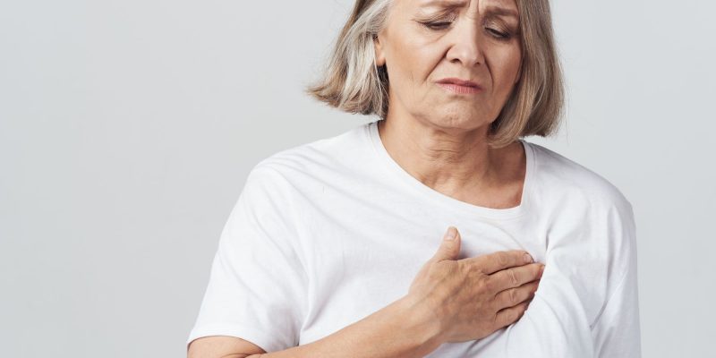 senior woman with heartburn