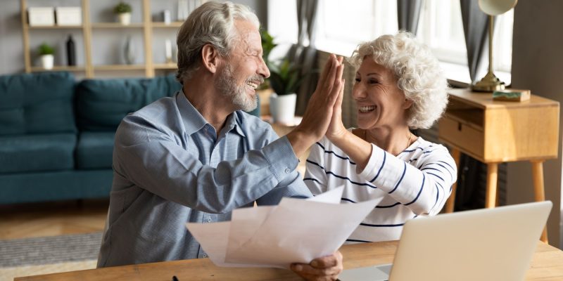 high-fiving seniors