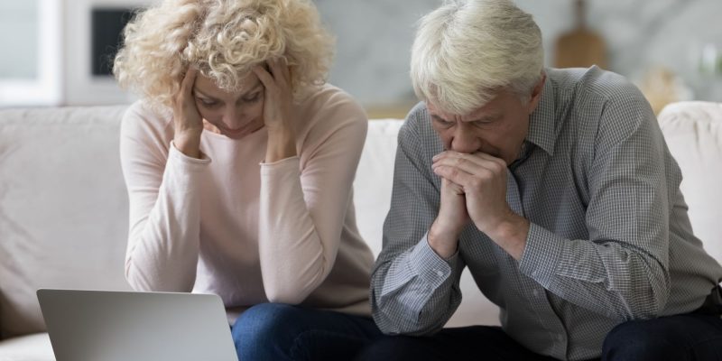 stressed senior couple