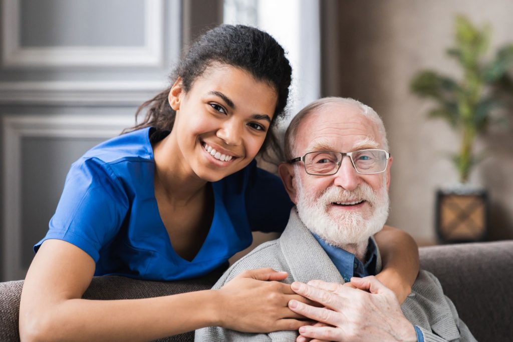 caregiver and senior adult reciving home care