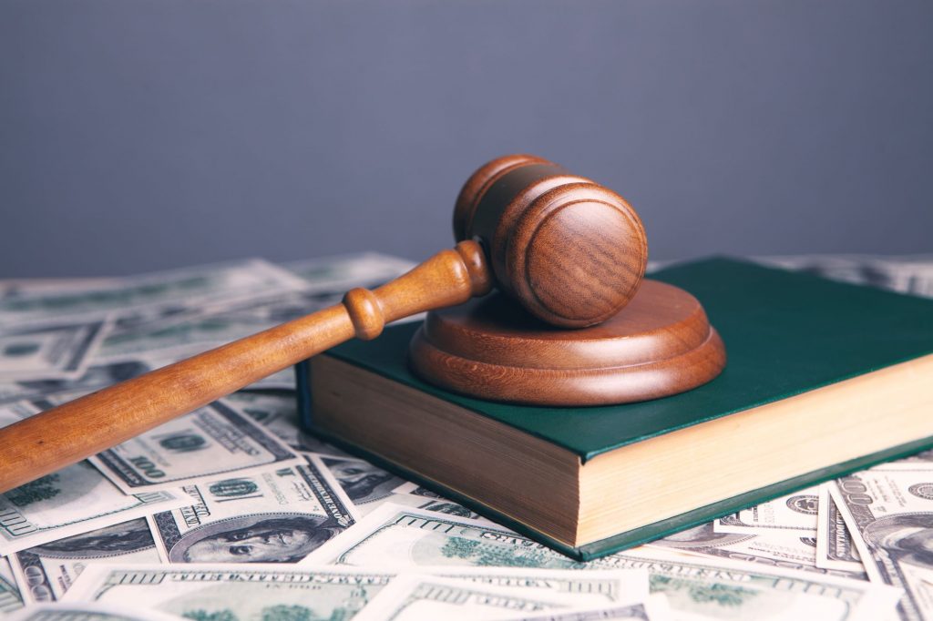 money with a book and gavel, symbolizing estate planning and probate law