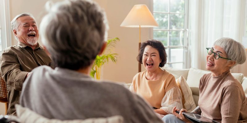 seniors laughing in the living room