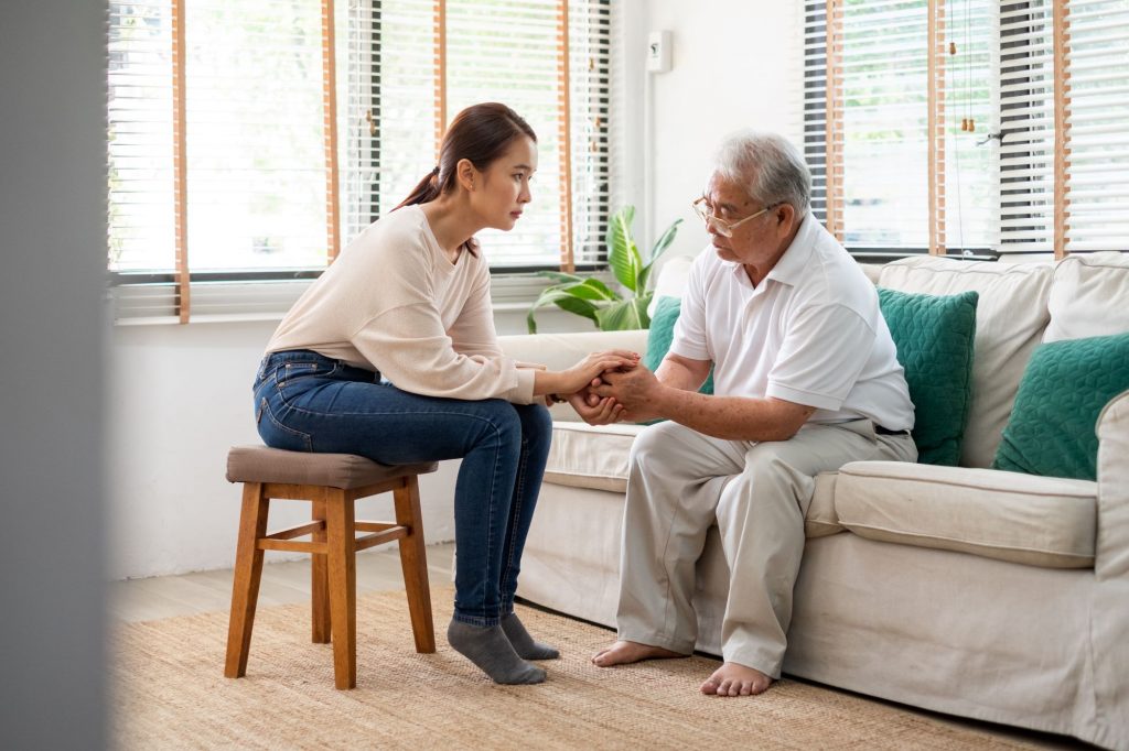 young woman and senior adult father
