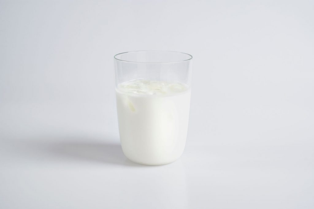 glass of milk sitting alone