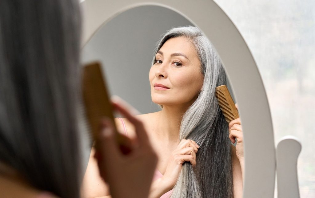 senior lady combing hair