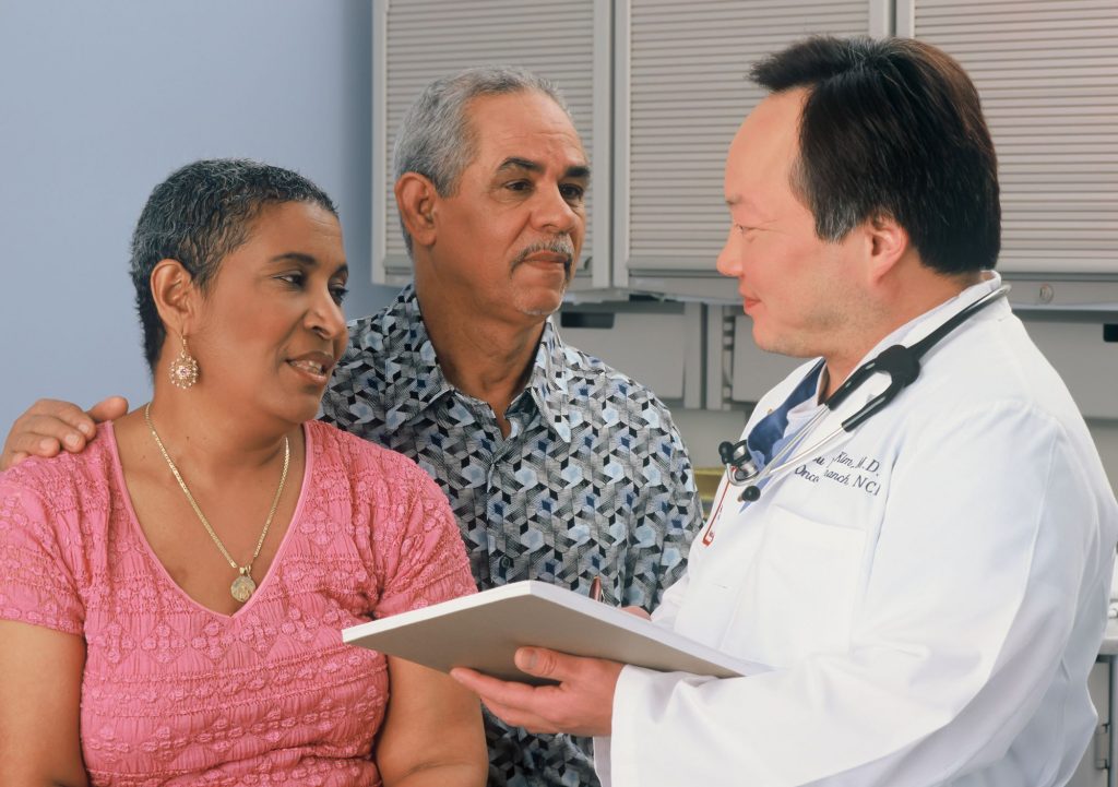 doctor with two senior patients