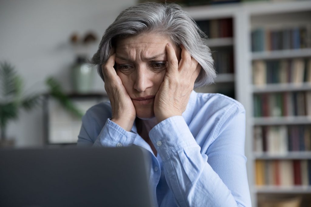 stressed slumped at computer