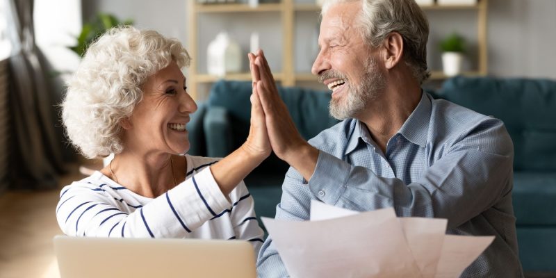 high fives retirement couple