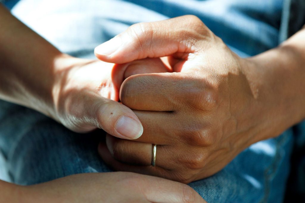Holding hands in a hospital