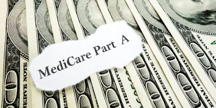 Medicare part A on a stack of cash