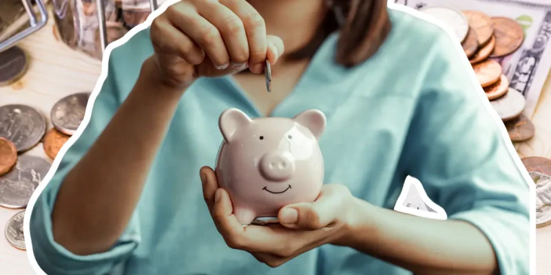 saving money in a piggy bank, up close photo with money in the background