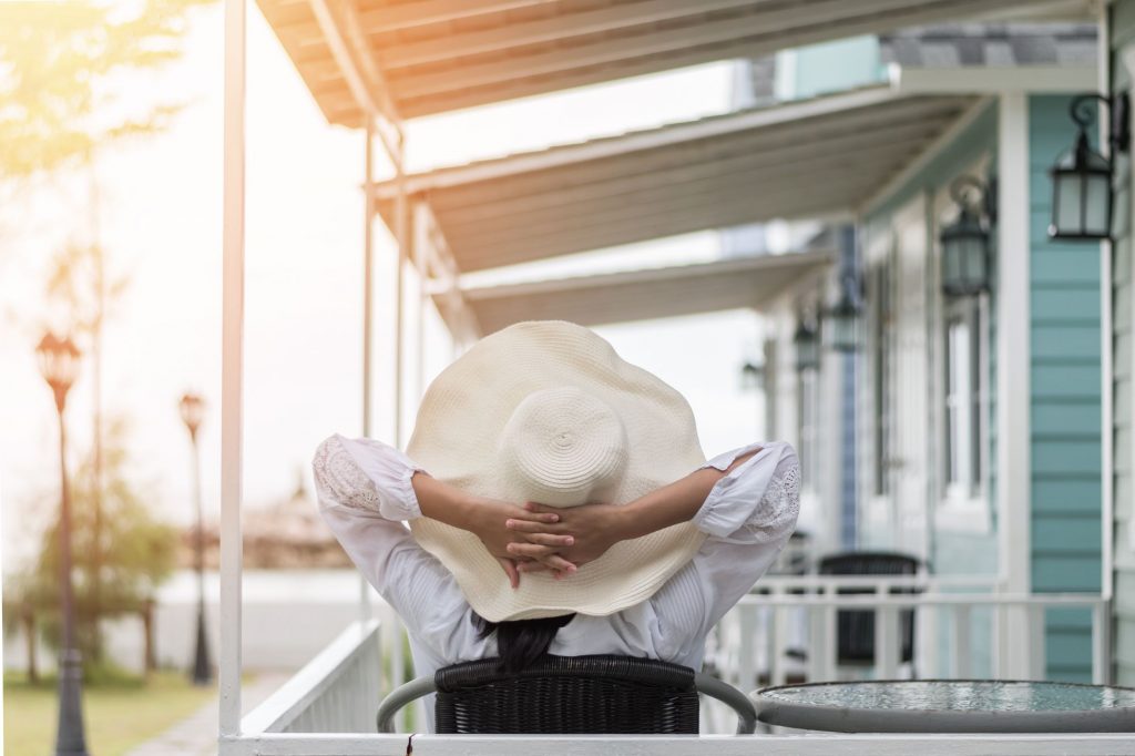 lady with a floppy hat relaxing