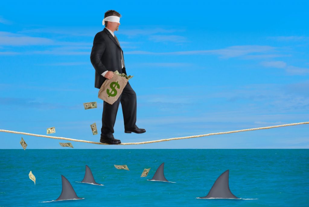 money sharks symbolizing a bad financial plan