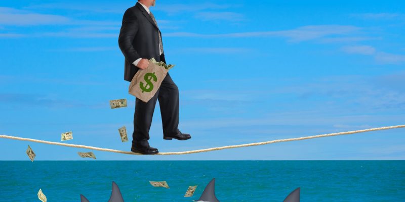money sharks symbolizing a bad financial plan