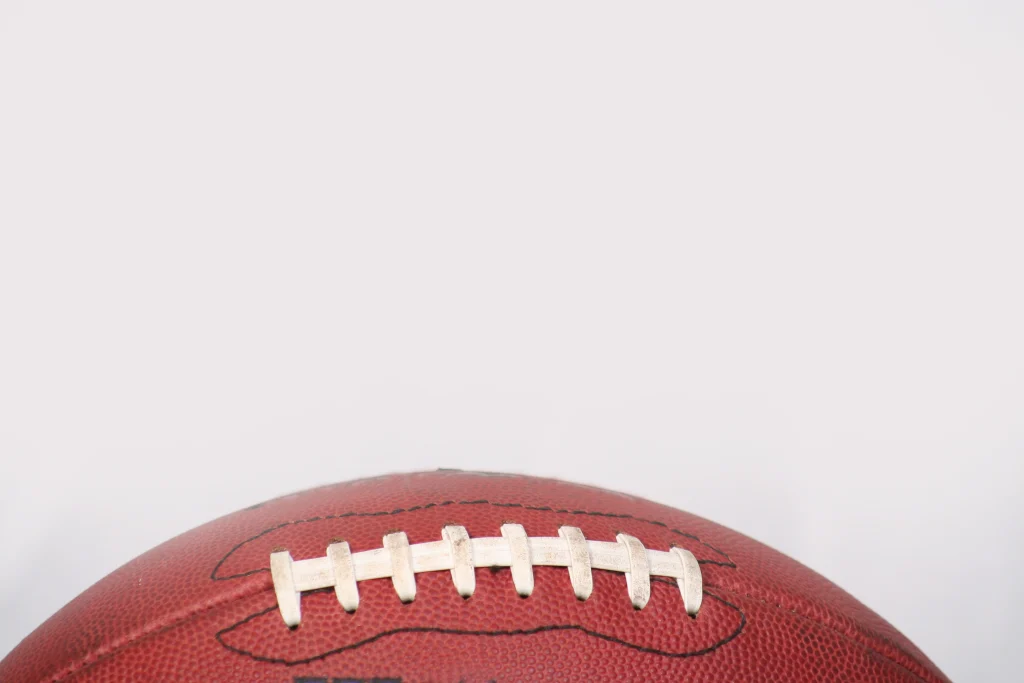 football, weighted on the bottom, negative space at top