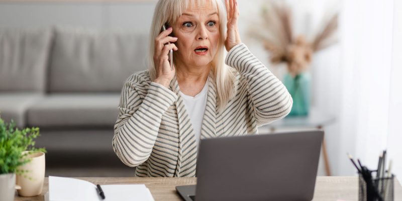 senior woman on phone saying uh oh