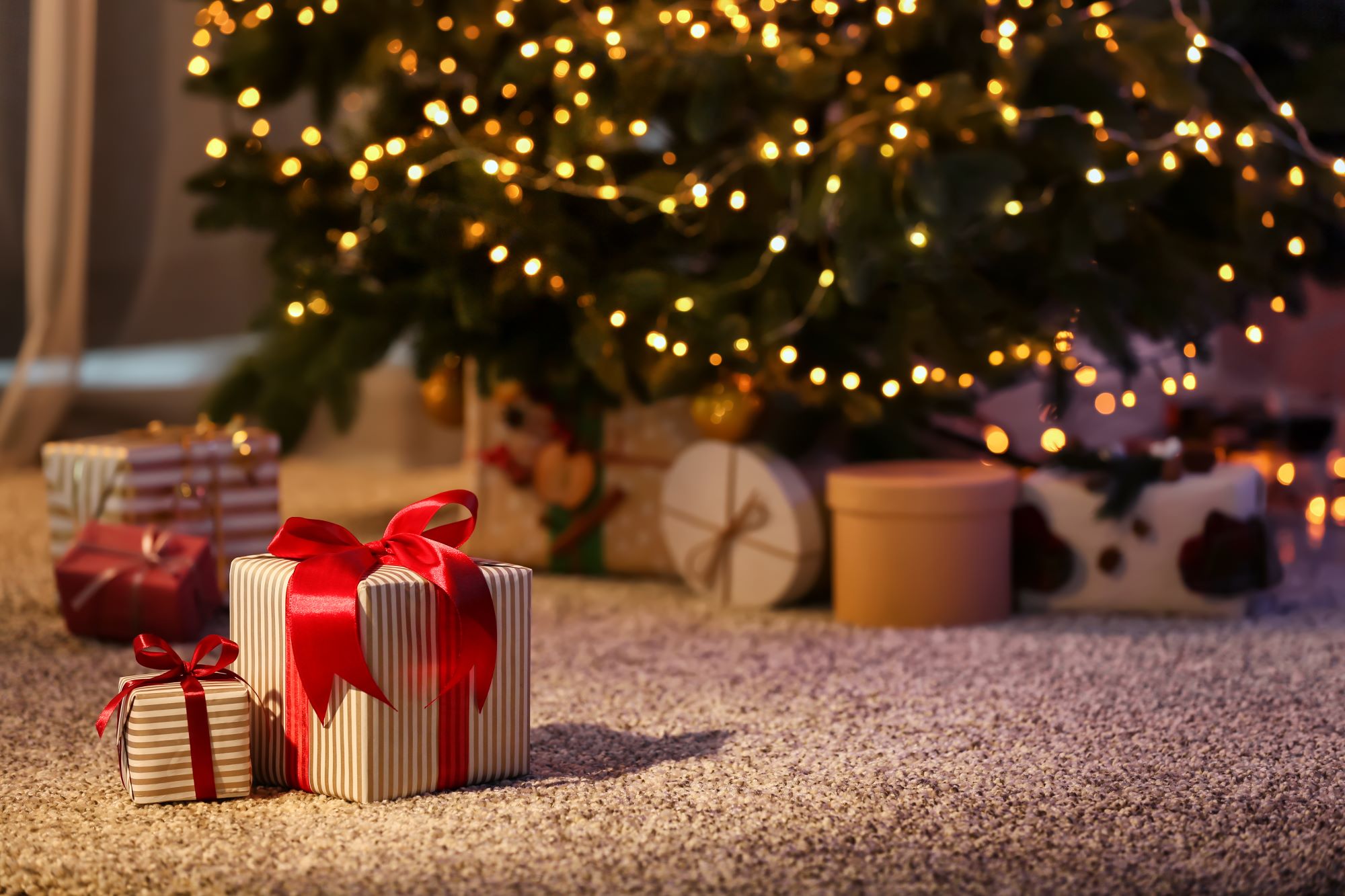 christmas gifts under a tree