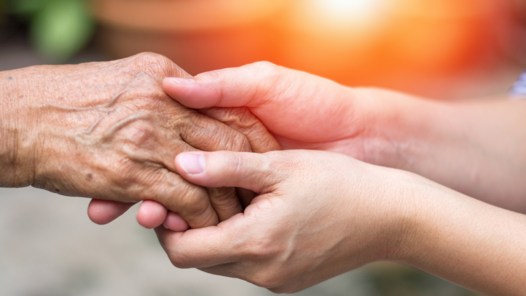 caregiver hand holding