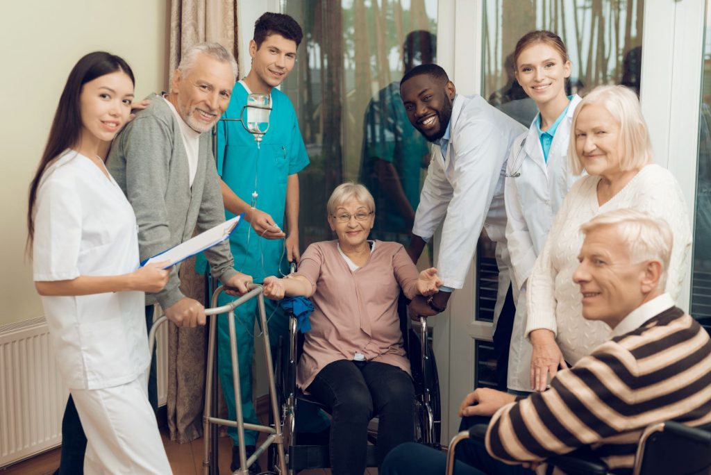 diverse group of older adults and caregivers, including doctors and nurses