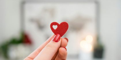 paper heart in a woman's hand