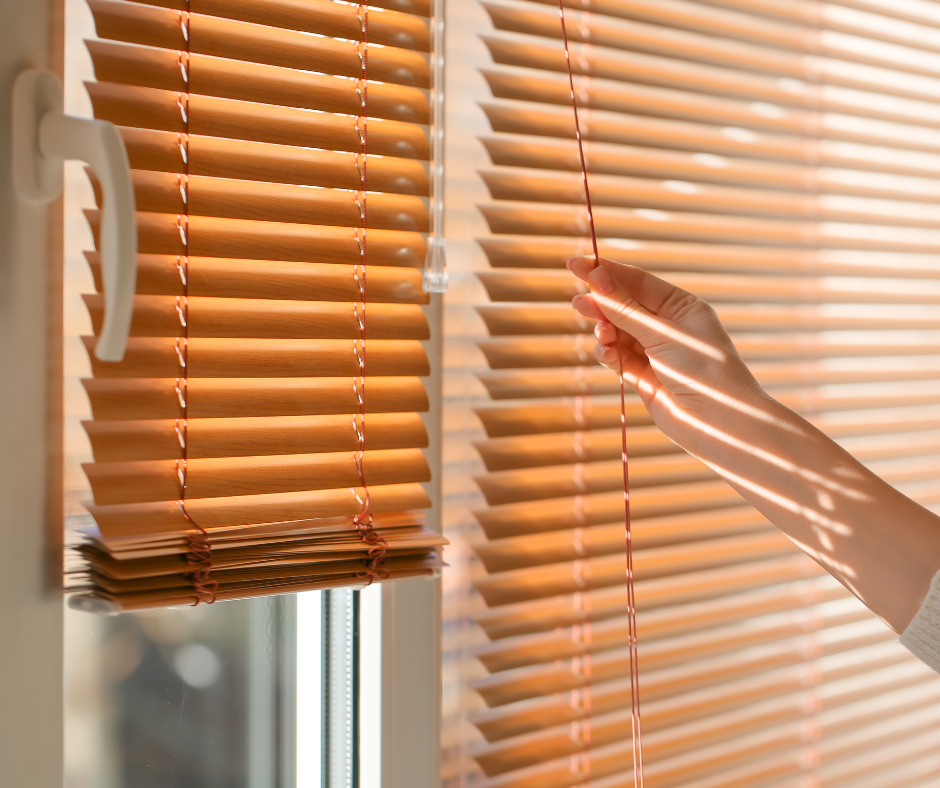 open window blinds, hand opening them