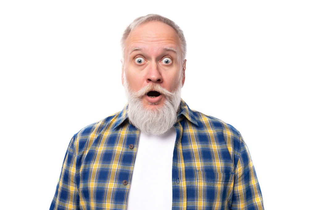 bearded man with wide eyes