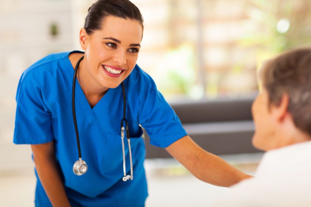 nurse with a patient smiling