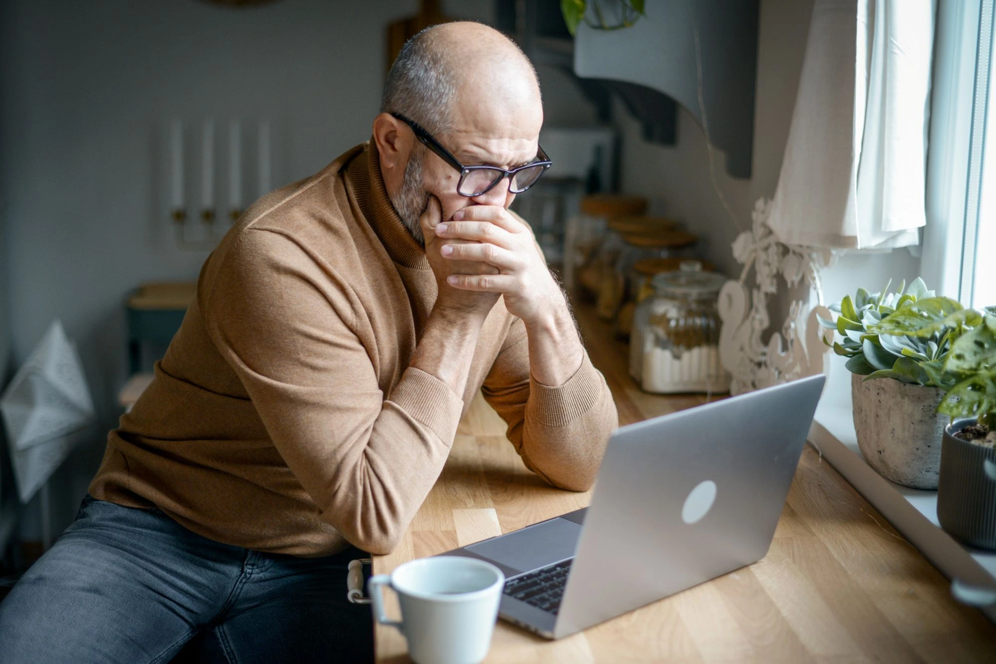 stressed boomer on his laptop