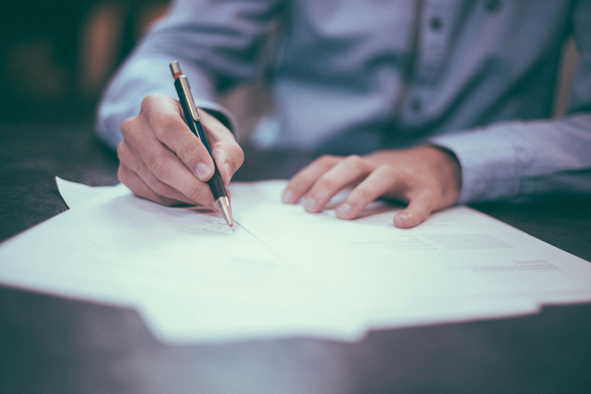 papers on a table being signed