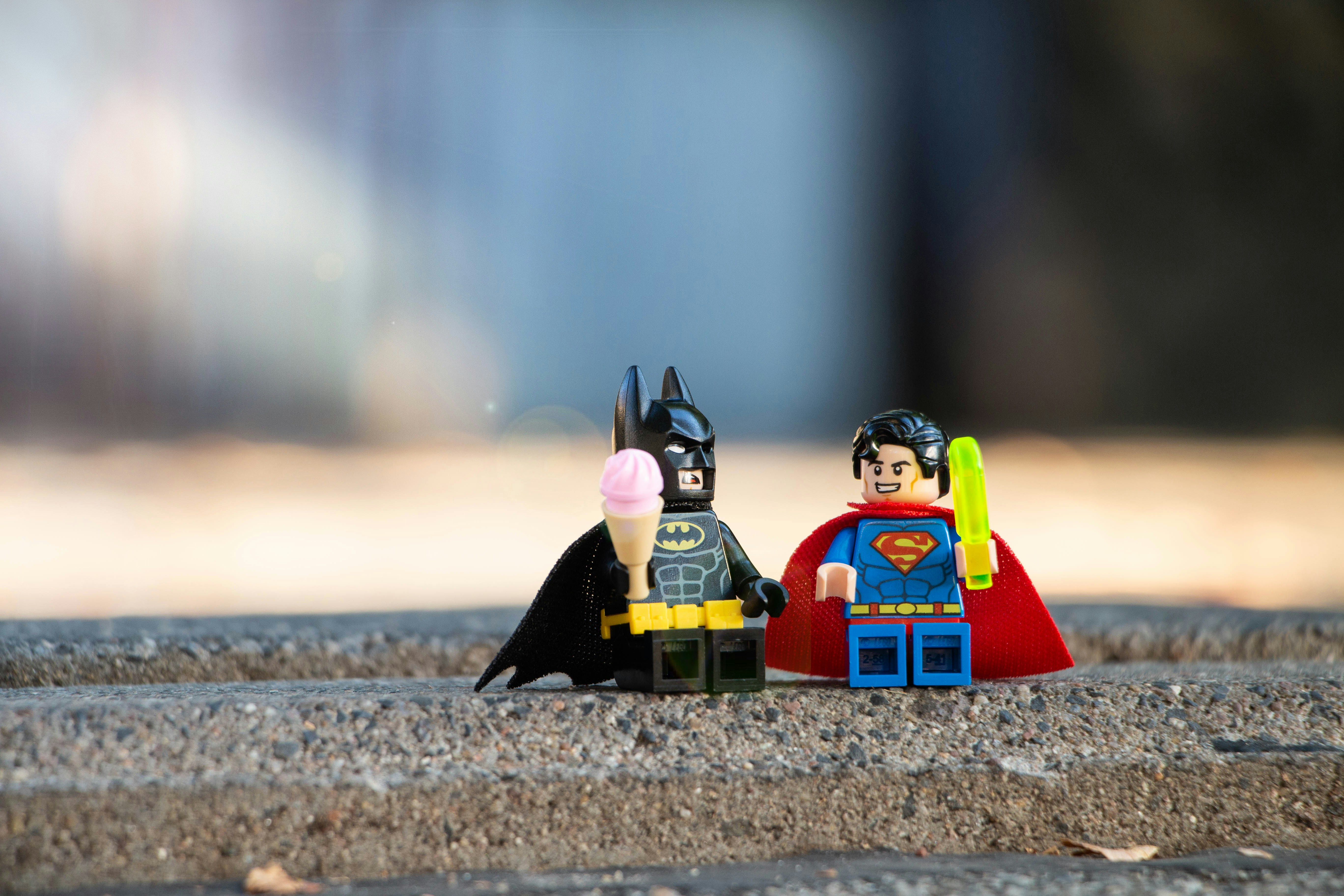batman and superman lego characters eating ice cream together