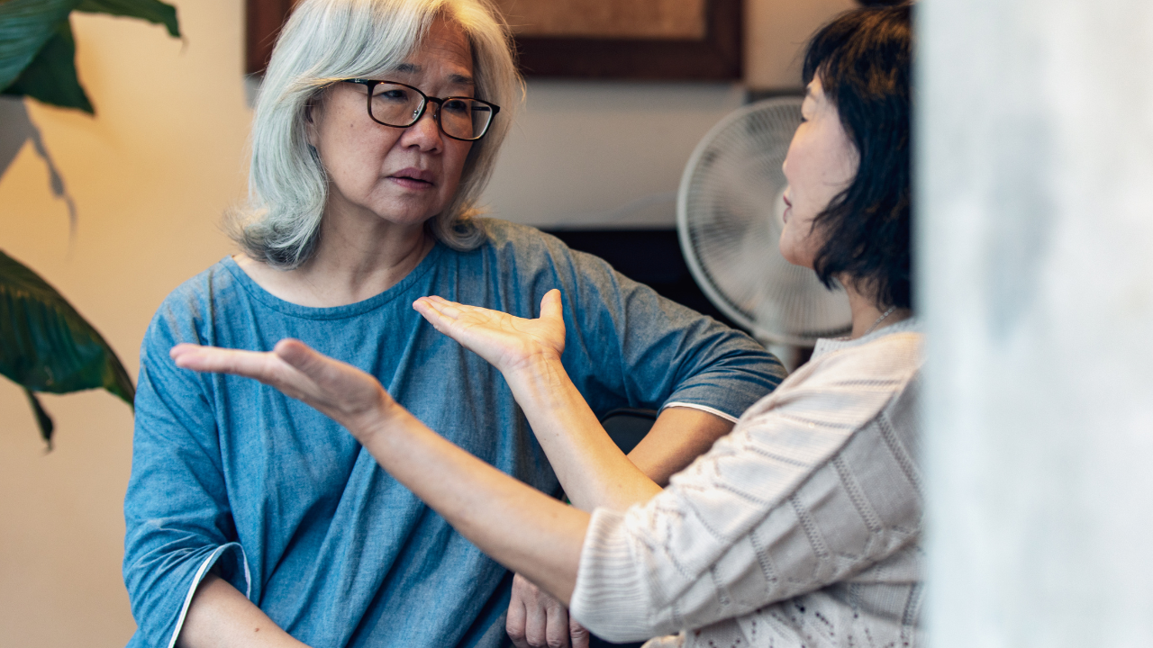 two asain senior women arguing