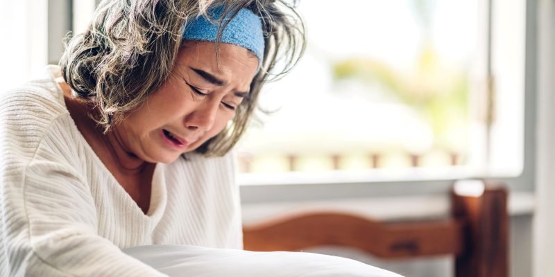 Asain senior woman crying